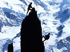 Rock Climbers Silhouetted by Mt. Blanc. France